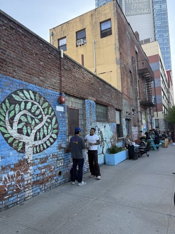 Mural-covered Long Island City street at dusk